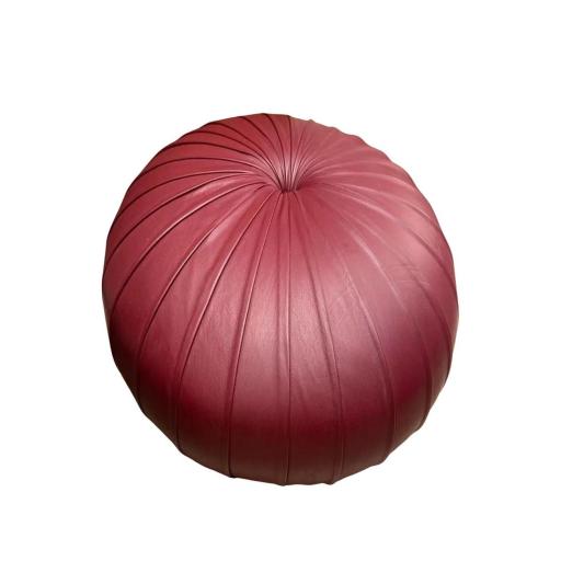 A Pair Of Maroon Leather Pouffes by Poltrona Frau